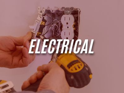 Image with the word "Electrical" overlaying an image of a person fixing an electrical outlet.