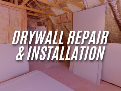 Image with the words "Drywall Repair & Installation" overlaying an image of drywall sheets laying up against an unfinished wall.